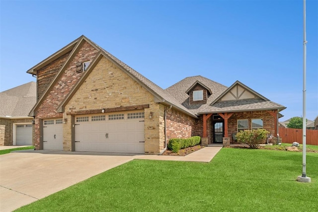 917 NW 186th St, Edmond, OK 73012 - view of front of house featuring a garage, driveway, roof with shingles, and brick siding