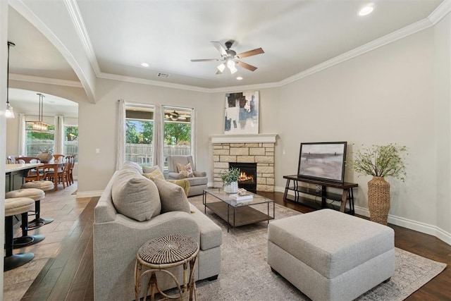 917 NW 186th St, Edmond, OK 73012 - living area featuring ceiling fan, hardwood / wood-style flooring, recessed lighting, ornamental molding, and a stone fireplace