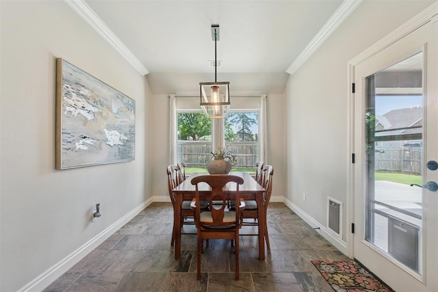 917 NW 186th St, Edmond, OK 73012 - dining area with crown molding and stone finish flooring