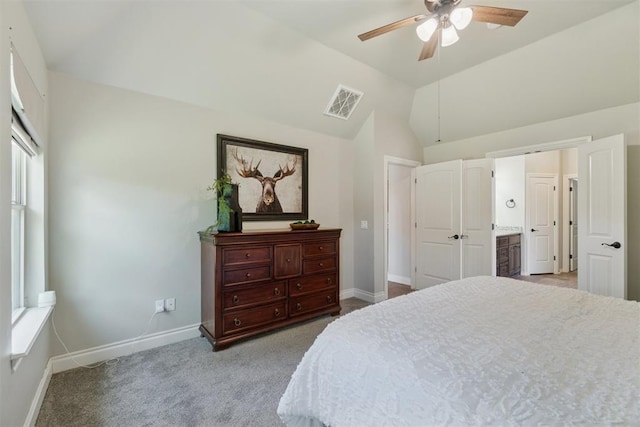 917 NW 186th St, Edmond, OK 73012 - carpeted bedroom featuring vaulted ceiling, a ceiling fan, and ensuite bathroom
