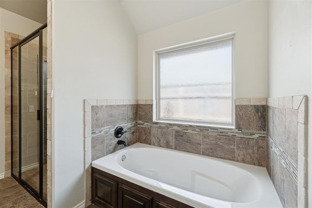 917 NW 186th St, Edmond, OK 73012 - bathroom featuring a bath, a shower stall, and lofted ceiling