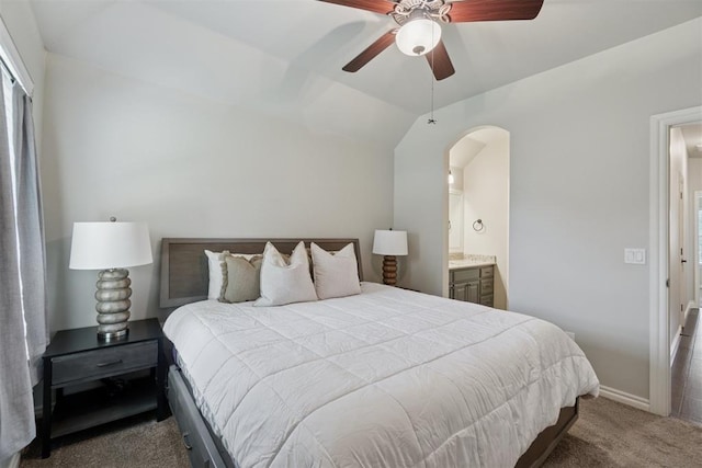 917 NW 186th St, Edmond, OK 73012 - carpeted bedroom with ensuite bath, lofted ceiling, and ceiling fan