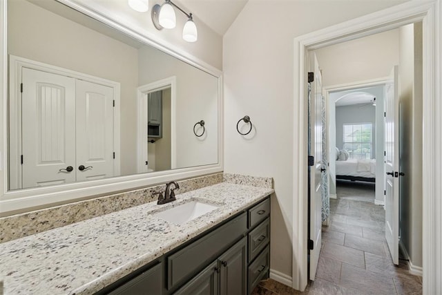917 NW 186th St, Edmond, OK 73012 - ensuite bathroom featuring vanity and baseboards