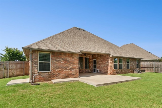 917 NW 186th St, Edmond, OK 73012 - back of property featuring roof with shingles, a fenced backyard, a patio, and brick siding
