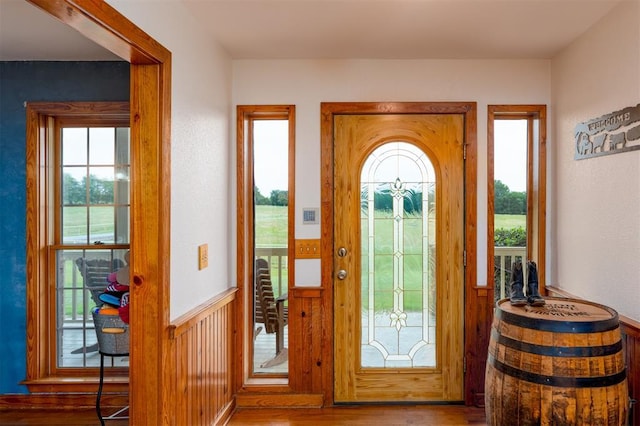 498 Big Horn Rd, Mcalester, OK 74501 - foyer entrance with wood finished floors, healthy amount of natural light, and wainscoting