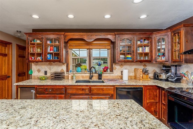 498 Big Horn Rd, Mcalester, OK 74501 - kitchen with dishwasher, range, glass insert cabinets, recessed lighting, and light stone counters