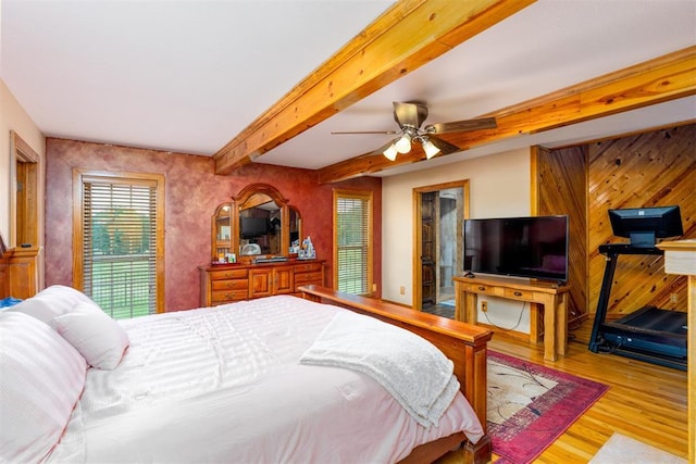 498 Big Horn Rd, Mcalester, OK 74501 - bedroom featuring wood finished floors, beamed ceiling, and a ceiling fan
