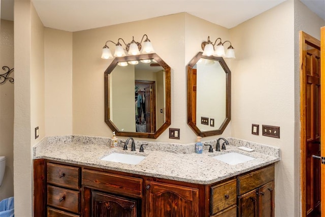 498 Big Horn Rd, Mcalester, OK 74501 - bathroom with double vanity and toilet