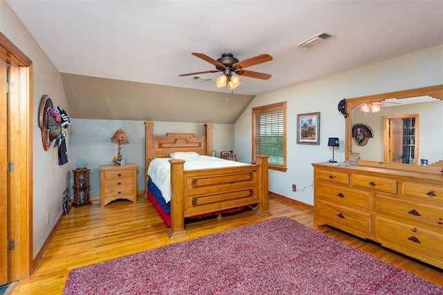 498 Big Horn Rd, Mcalester, OK 74501 - bedroom with light wood finished floors, vaulted ceiling, and a ceiling fan