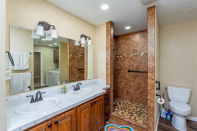 498 Big Horn Rd, Mcalester, OK 74501 - full bathroom with independent washer and dryer, walk in shower, double vanity, wood finished floors, and recessed lighting