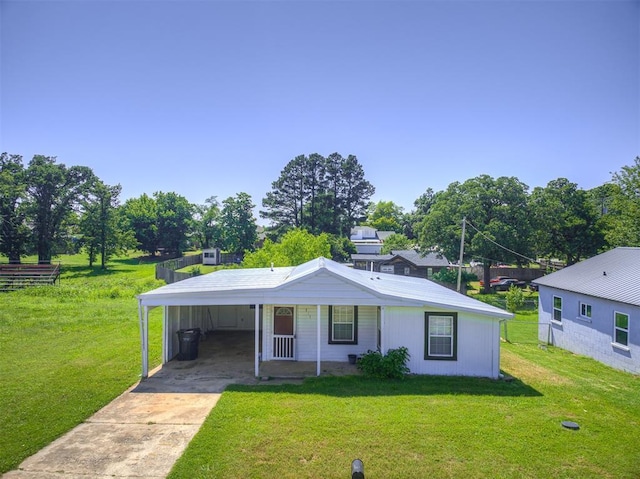 211 S 6th St, Mcloud, OK 74851 - view of front of property with driveway, a carport, and a front lawn