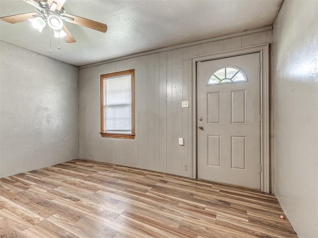 211 S 6th St, Mcloud, OK 74851 - foyer with a ceiling fan and light wood finished floors