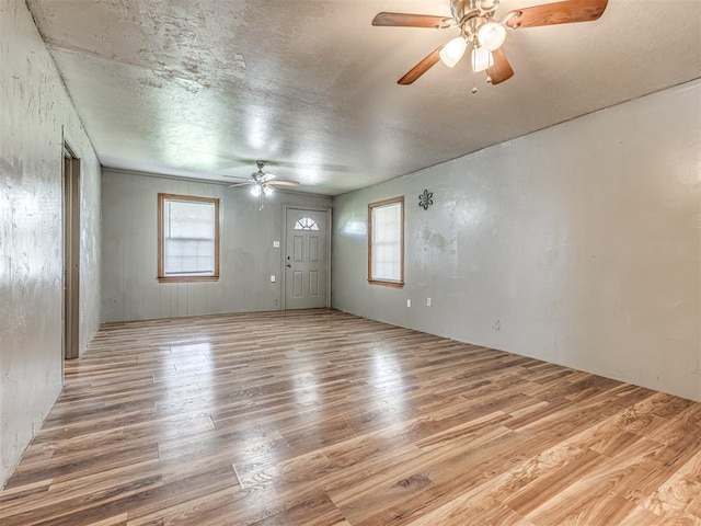 211 S 6th St, Mcloud, OK 74851 - spare room featuring a ceiling fan, wood finished floors, and a textured ceiling