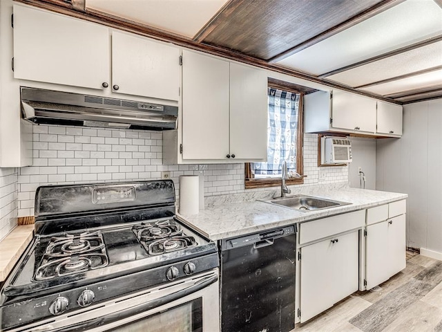211 S 6th St, Mcloud, OK 74851 - kitchen featuring stainless steel range with gas stovetop, under cabinet range hood, dishwasher, a sink, and light wood-style flooring