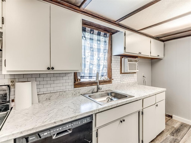 211 S 6th St, Mcloud, OK 74851 - kitchen with a sink, dishwasher, light countertops, and light wood-type flooring