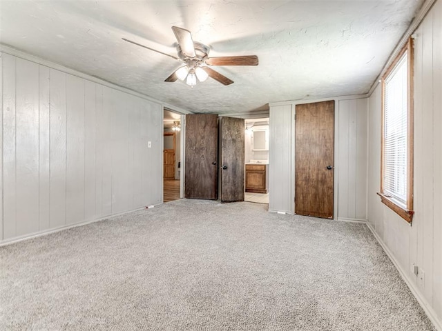 211 S 6th St, Mcloud, OK 74851 - unfurnished bedroom featuring carpet, a ceiling fan, and ensuite bathroom