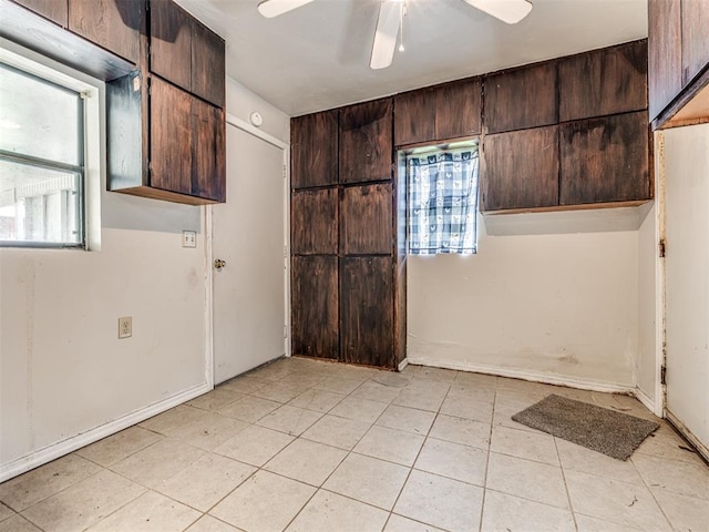 211 S 6th St, Mcloud, OK 74851 - empty room with ceiling fan and light tile patterned flooring