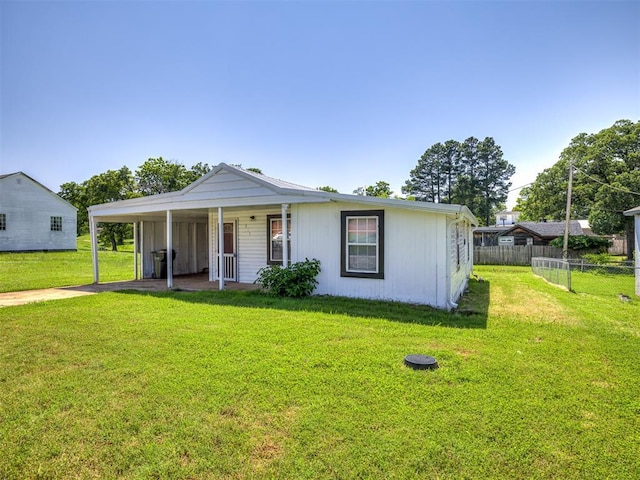 211 S 6th St, Mcloud, OK 74851 - view of front of property with an attached carport and concrete driveway