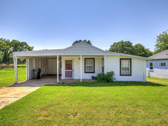 211 S 6th St, Mcloud, OK 74851 - ranch-style home with driveway, an attached carport, and covered porch