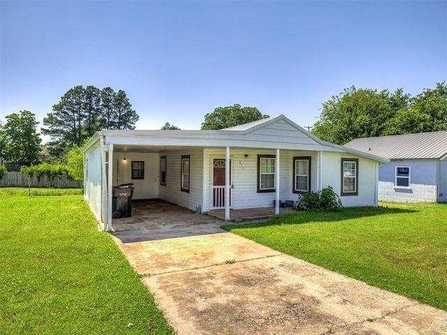 211 S 6th St, Mcloud, OK 74851 - view of front of property featuring driveway, a front lawn, covered porch, and an attached carport