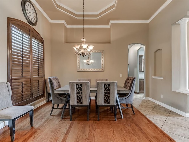 1316 NW 171st St, Edmond, OK 73012 - dining room with arched walkways, crown molding, and light tile patterned floors