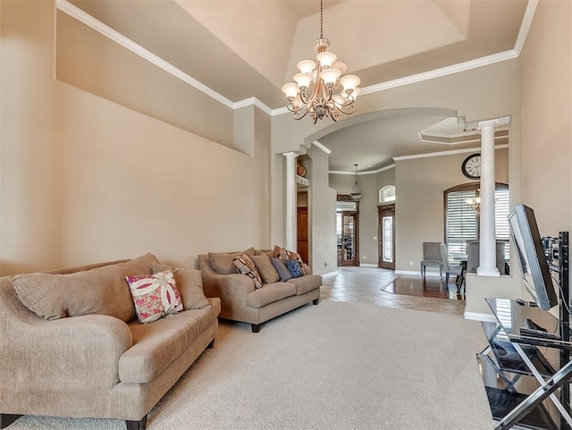 1316 NW 171st St, Edmond, OK 73012 - tiled living area featuring ornate columns, arched walkways, ornamental molding, a chandelier, and carpet