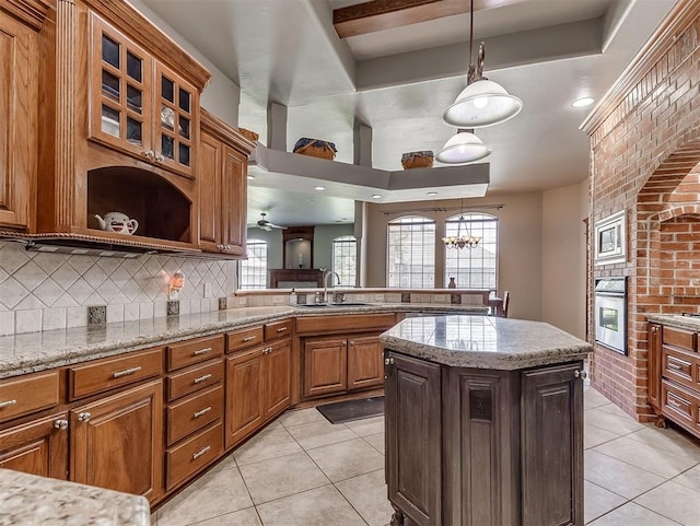 1316 NW 171st St, Edmond, OK 73012 - kitchen with stainless steel appliances, light tile patterned flooring, open shelves, decorative backsplash, and brick wall