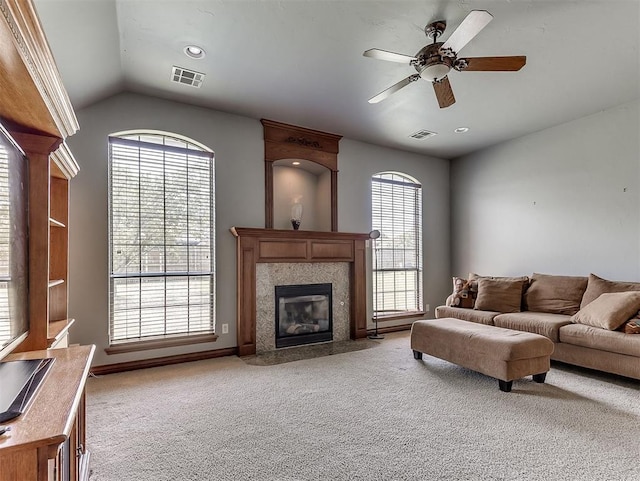 1316 NW 171st St, Edmond, OK 73012 - living room featuring light carpet, a ceiling fan, vaulted ceiling, and a fireplace