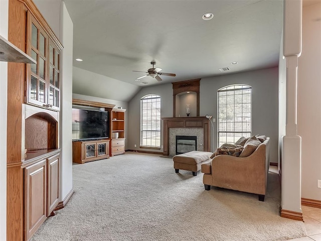 1316 NW 171st St, Edmond, OK 73012 - living room featuring light colored carpet, ceiling fan, a high end fireplace, vaulted ceiling, and recessed lighting