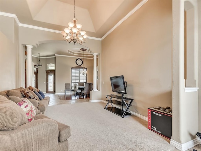 1316 NW 171st St, Edmond, OK 73012 - carpeted living room with a chandelier, decorative columns, ornamental molding, and arched walkways