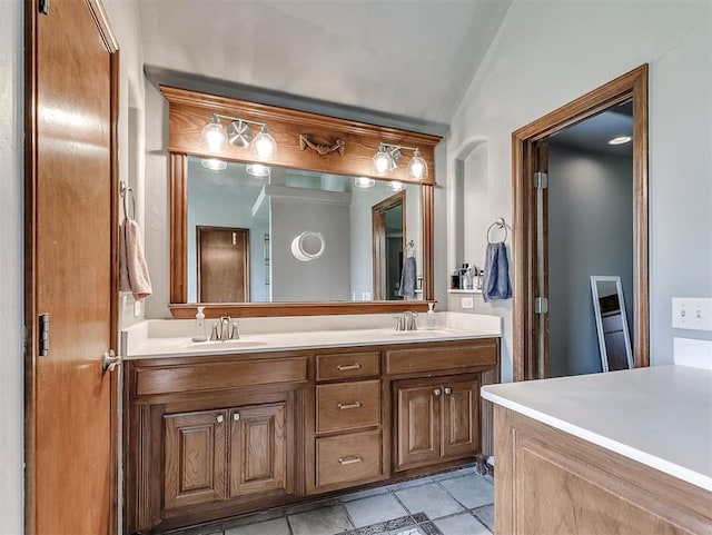 1316 NW 171st St, Edmond, OK 73012 - full bathroom featuring double vanity, lofted ceiling, and tile patterned floors