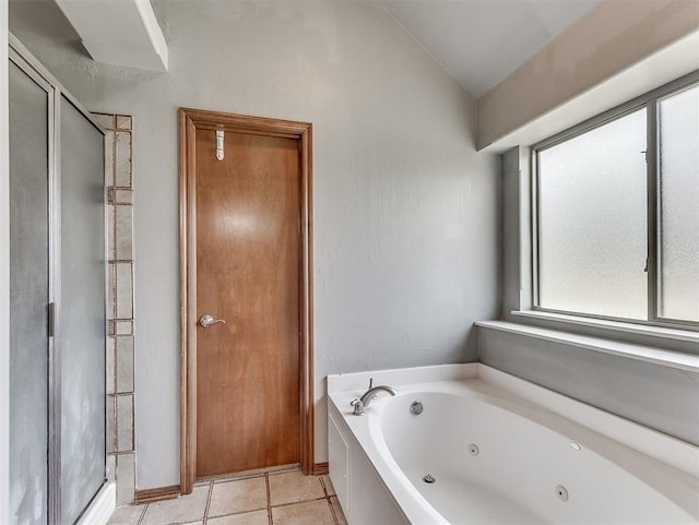 1316 NW 171st St, Edmond, OK 73012 - full bathroom featuring a tub with jets, lofted ceiling, and tile patterned flooring