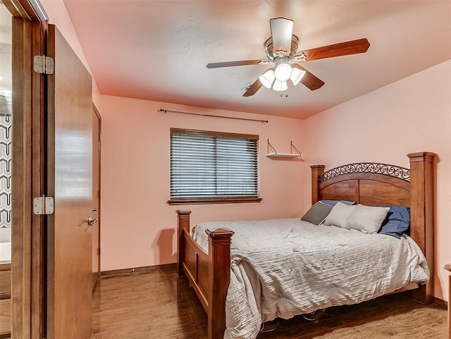 1316 NW 171st St, Edmond, OK 73012 - bedroom with wood finished floors and a ceiling fan