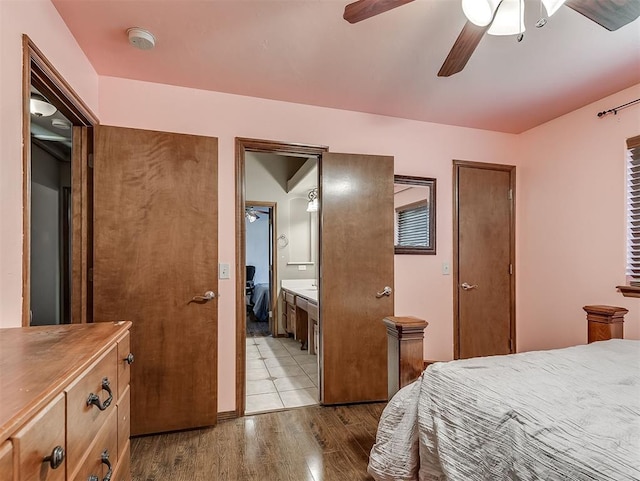 1316 NW 171st St, Edmond, OK 73012 - bedroom with dark wood-type flooring, a ceiling fan, and ensuite bathroom