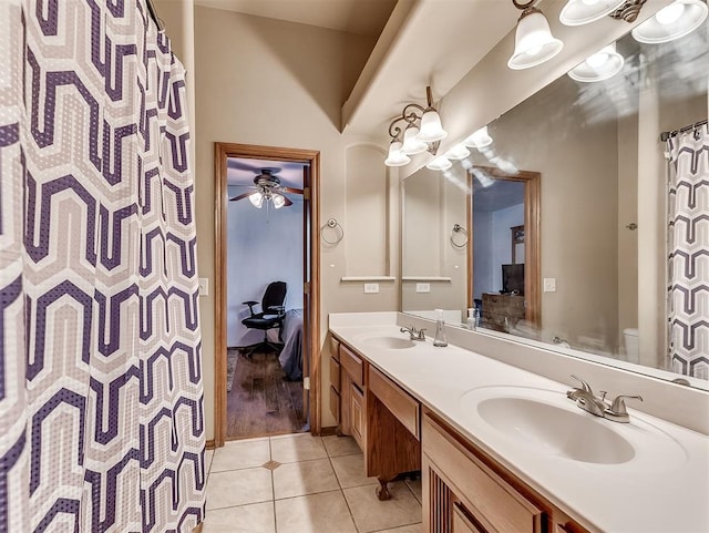 1316 NW 171st St, Edmond, OK 73012 - bathroom featuring ensuite bath, double vanity, tile patterned flooring, and a ceiling fan