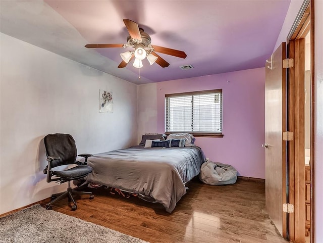 1316 NW 171st St, Edmond, OK 73012 - bedroom featuring wood finished floors and a ceiling fan