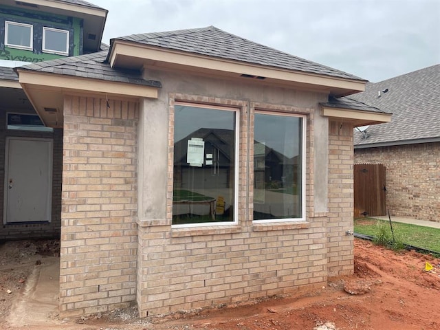4601 Hidalgo Ave, Mustang, OK 73064 - view of home's exterior with brick siding and roof with shingles