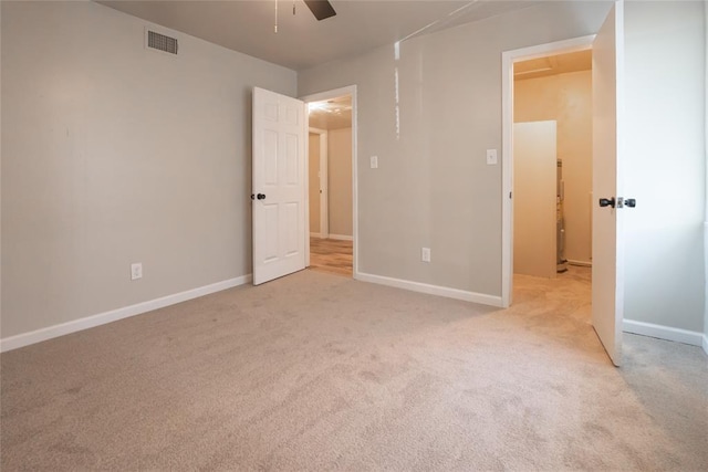 1725 E Lindsey St Unit 2, Norman, OK 73071 - unfurnished bedroom featuring light colored carpet and a ceiling fan