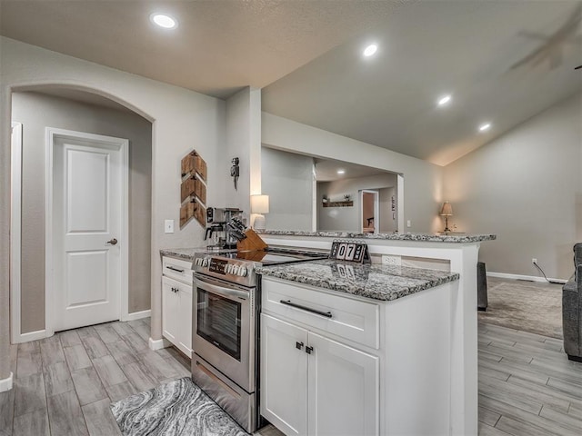 6513 NW 95th St, Oklahoma City, OK 73162 - kitchen with electric range, light wood-style flooring, light stone counters, baseboards, and recessed lighting