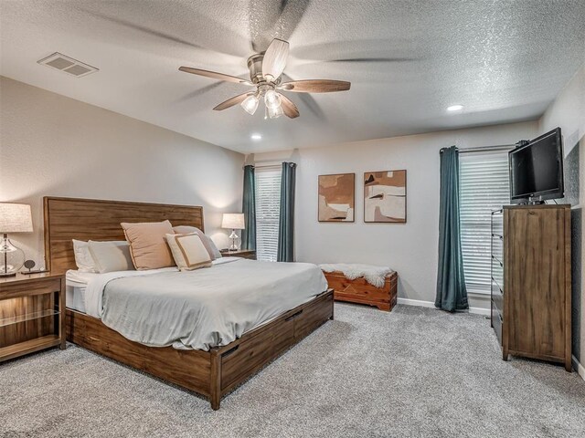 6513 NW 95th St, Oklahoma City, OK 73162 - bedroom with light colored carpet, a textured ceiling, a ceiling fan, baseboards, and recessed lighting