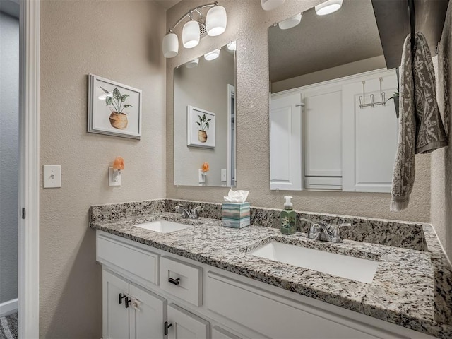 6513 NW 95th St, Oklahoma City, OK 73162 - full bath with double vanity and a textured wall