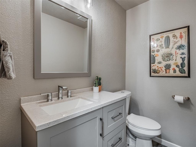 6513 NW 95th St, Oklahoma City, OK 73162 - bathroom with vanity, toilet, and a textured wall