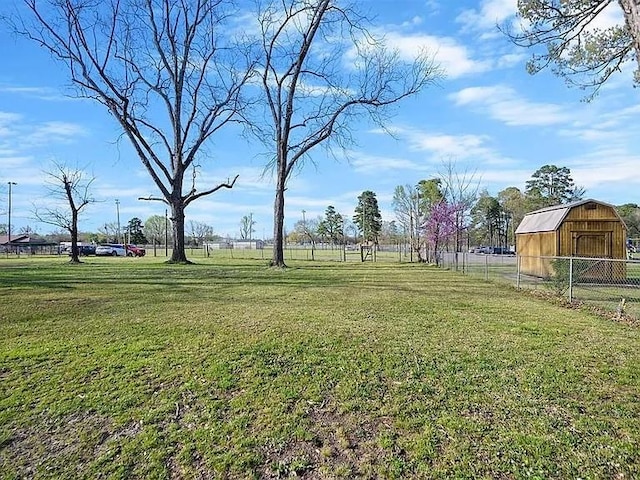 309 E Memorial St, Broken Bow, OK 74728 - view of yard featuring a barn and an outdoor structure