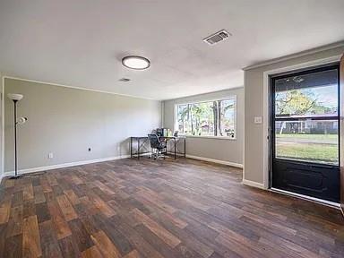 309 E Memorial St, Broken Bow, OK 74728 - office area featuring baseboards and dark wood-type flooring