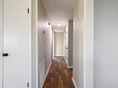 309 E Memorial St, Broken Bow, OK 74728 - corridor with baseboards