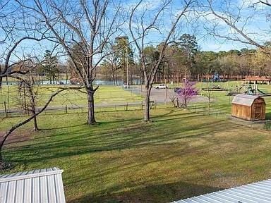 309 E Memorial St, Broken Bow, OK 74728 - view of community with a yard and an outdoor structure