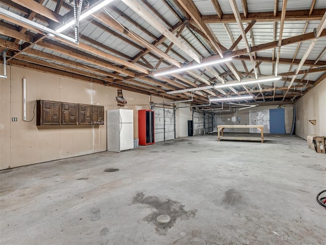 16101 S Rock Creek Rd, Shawnee, OK 74801 - garage with freestanding refrigerator
