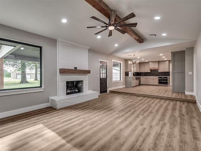 16101 S Rock Creek Rd, Shawnee, OK 74801 - unfurnished living room with baseboards, recessed lighting, a fireplace, and ceiling fan