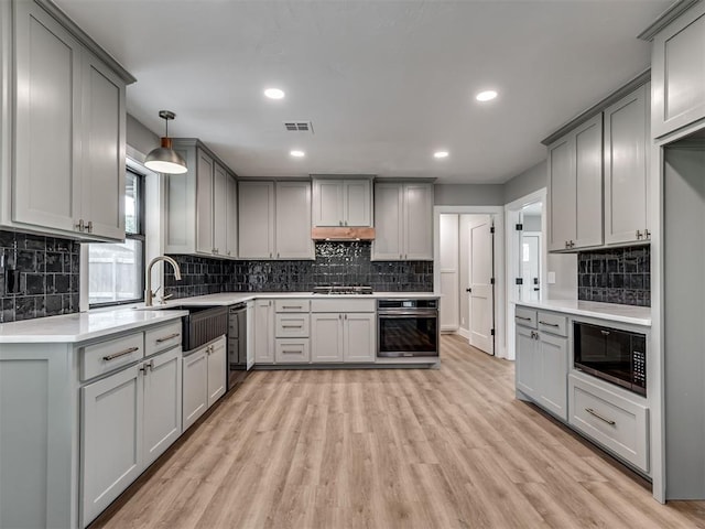 16101 S Rock Creek Rd, Shawnee, OK 74801 - kitchen with black appliances, gray cabinetry, a sink, tasteful backsplash, and recessed lighting