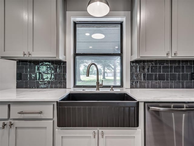 16101 S Rock Creek Rd, Shawnee, OK 74801 - kitchen with dishwasher, a sink, backsplash, and light stone counters